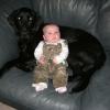 Three-month old Kylie and her favorite lab, Trigger, hanging out.