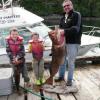 Tom and Clayton Dame with Uncle and his 50 lb. Ling cod on a dock just outside of Prince Rupert, B.C.